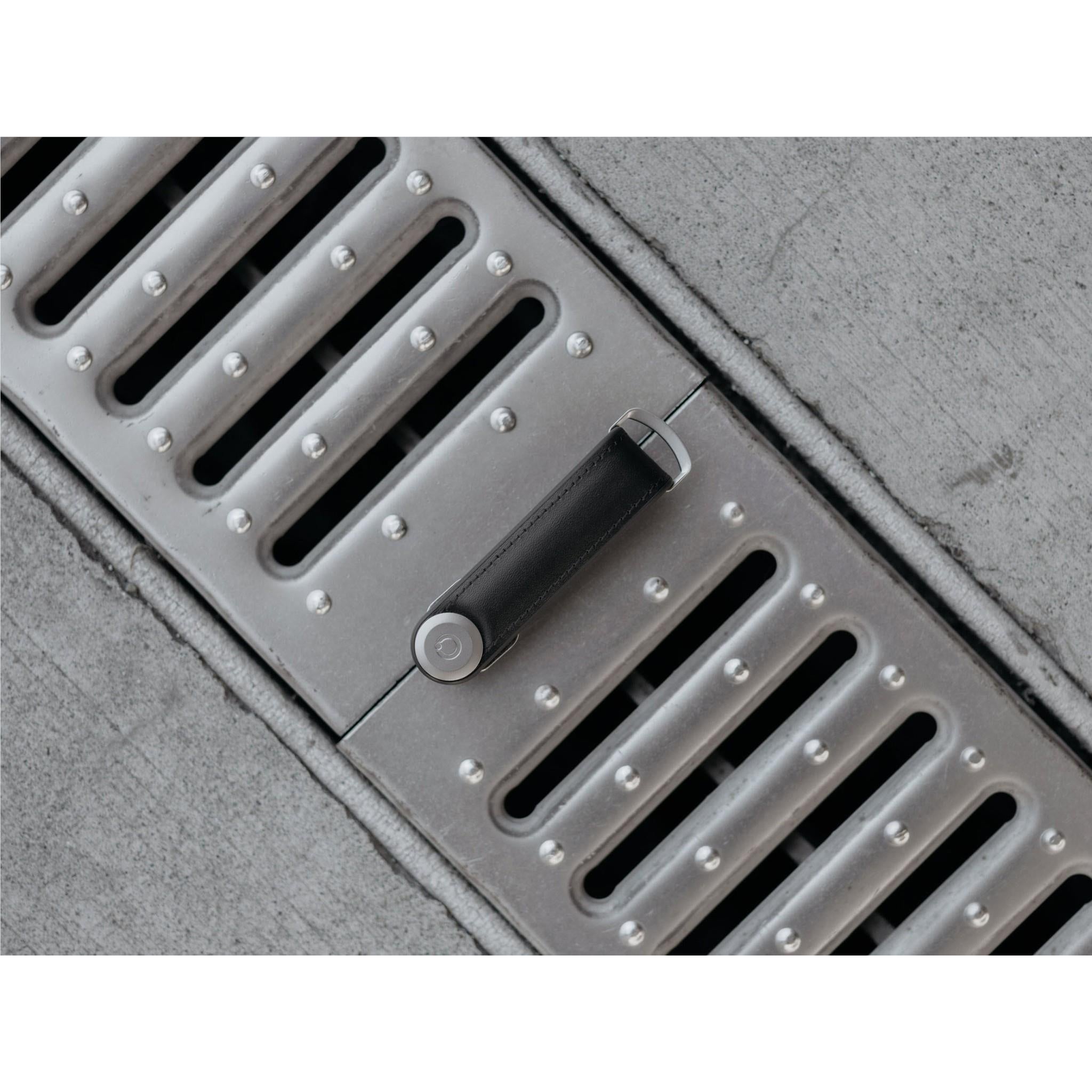 Black leather key organiser interior with metal key slots and lock button
