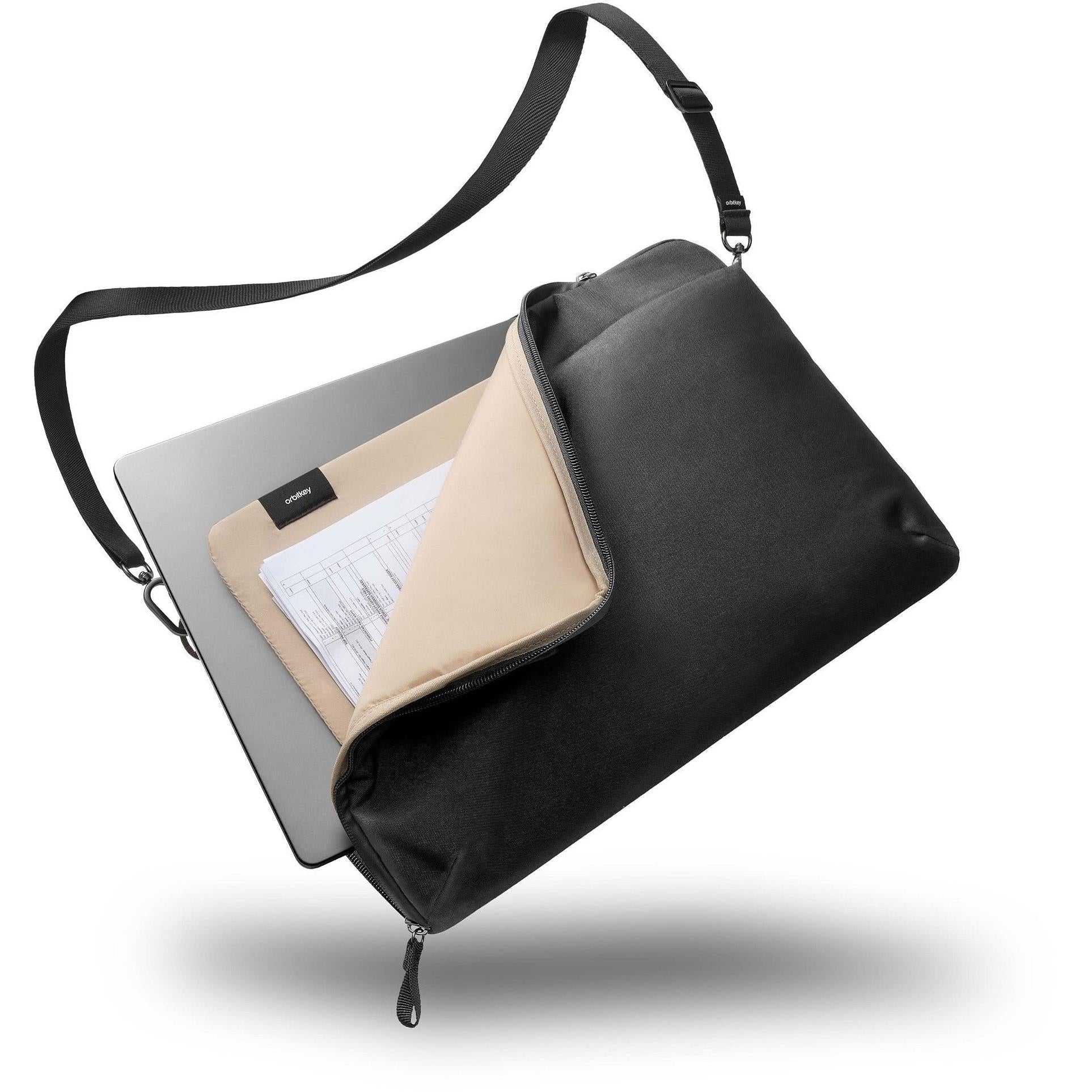 Black laptop sleeve with shoulder strap, open top showing interior documents.