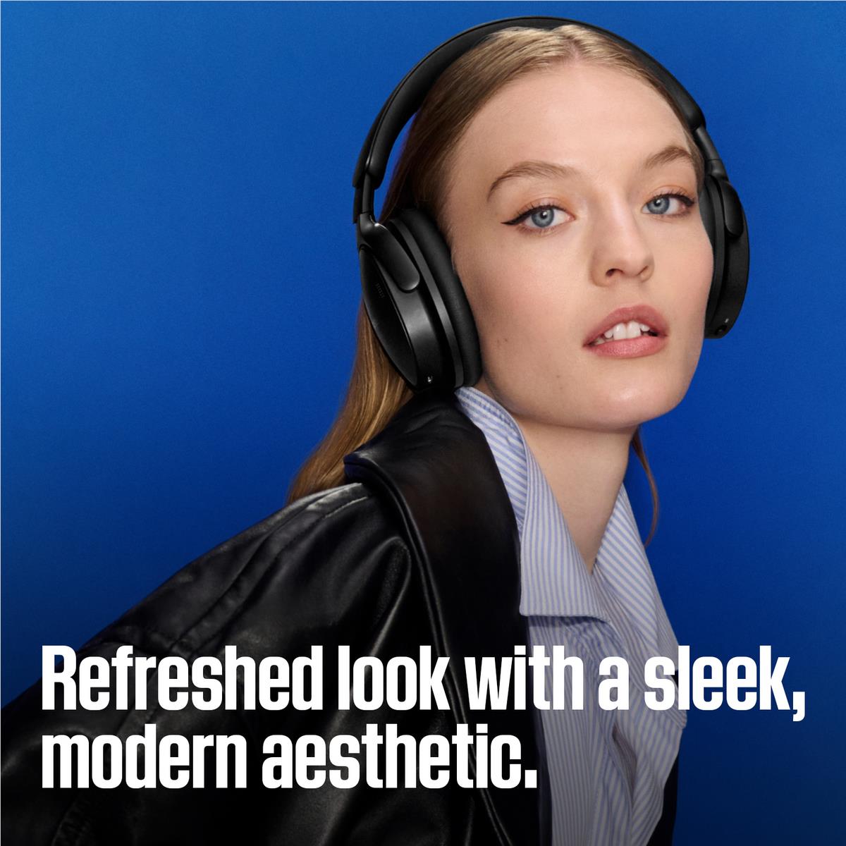 Black Bose over-ear headphones worn by a person with padded earcups