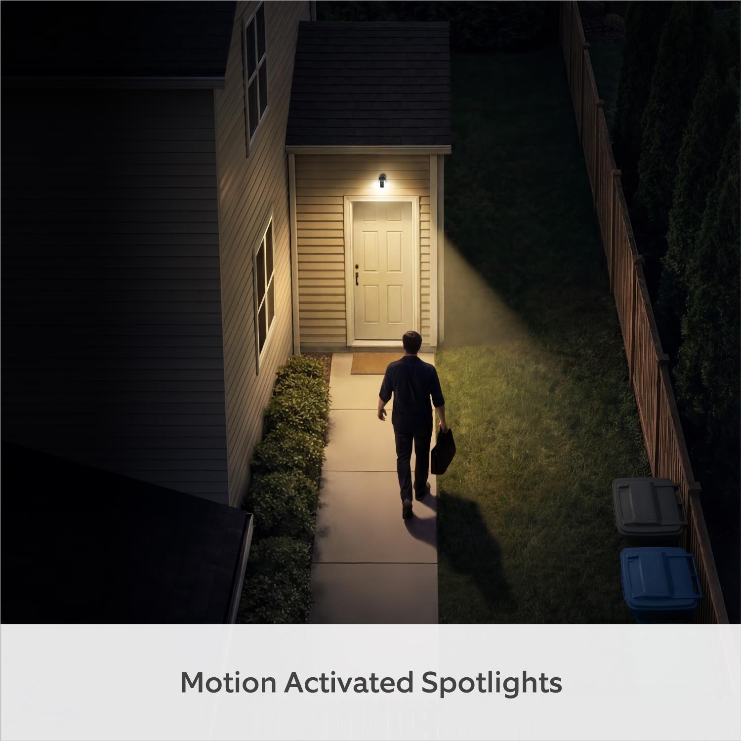 White Ring wireless spotlight camera projecting light onto an outdoor walkway.