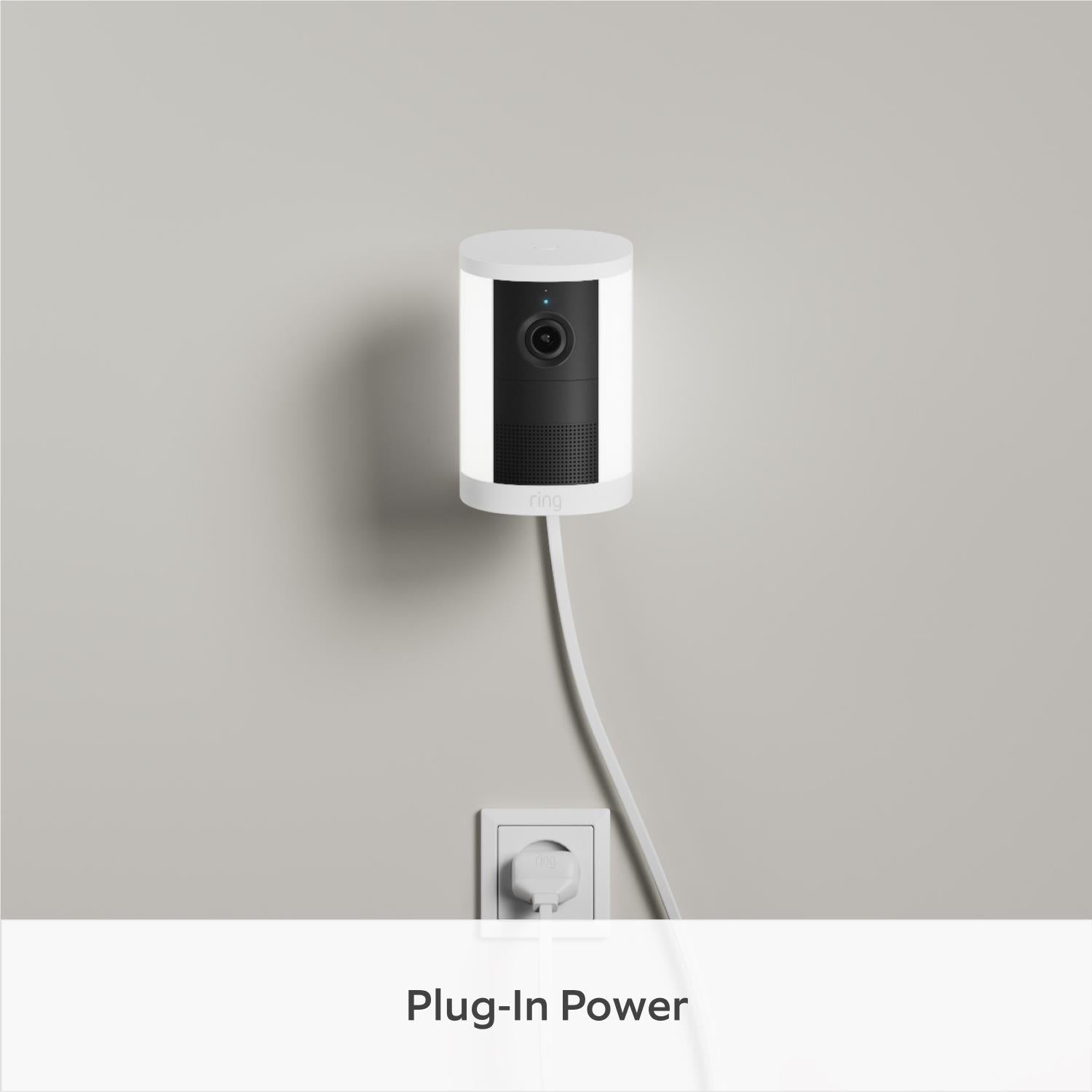 White ring plug-in spotlight camera with front lens and power cable
