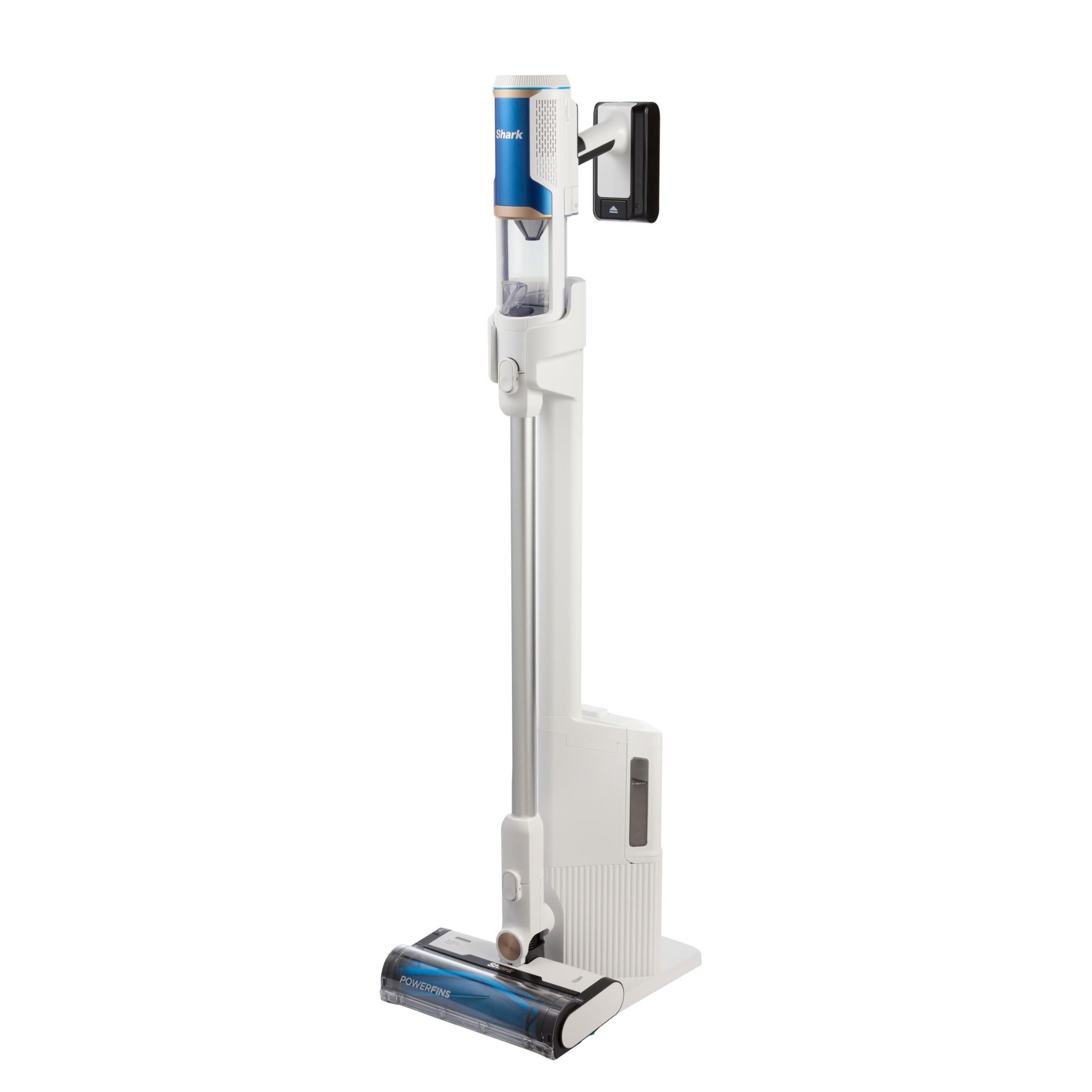 White cordless stick vacuum with auto-empty base and blue dust canister.