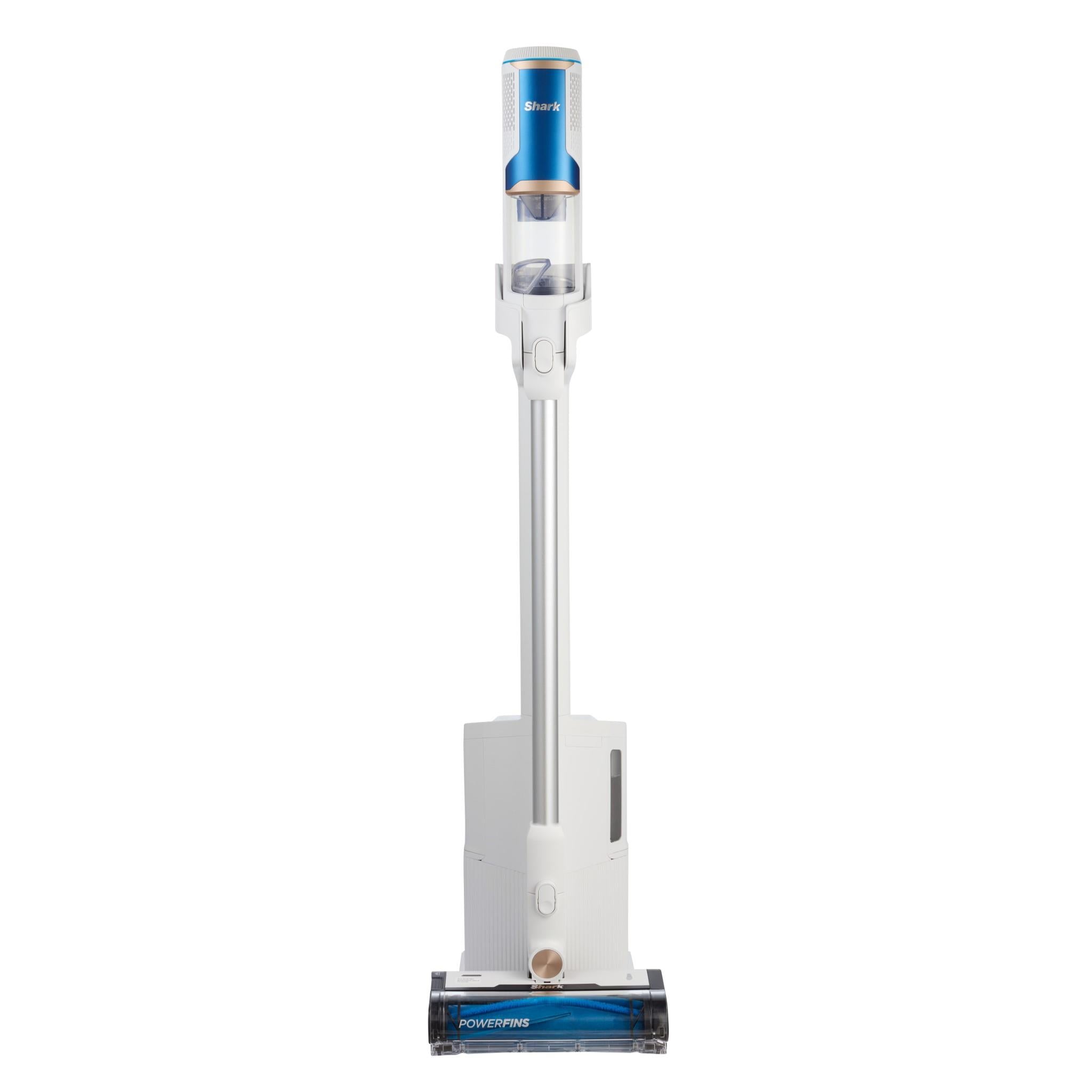 Upright cordless stick vacuum on charging dock with blue dust canister.
