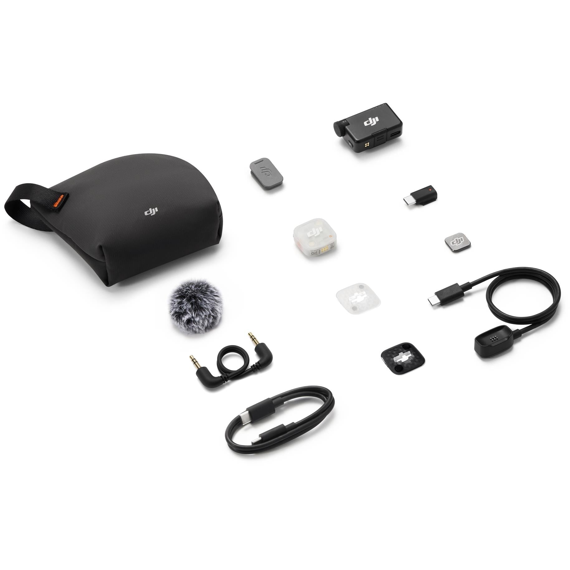 Wireless mic kit with black pouch, adapters, cables, small receiver and transmitter components