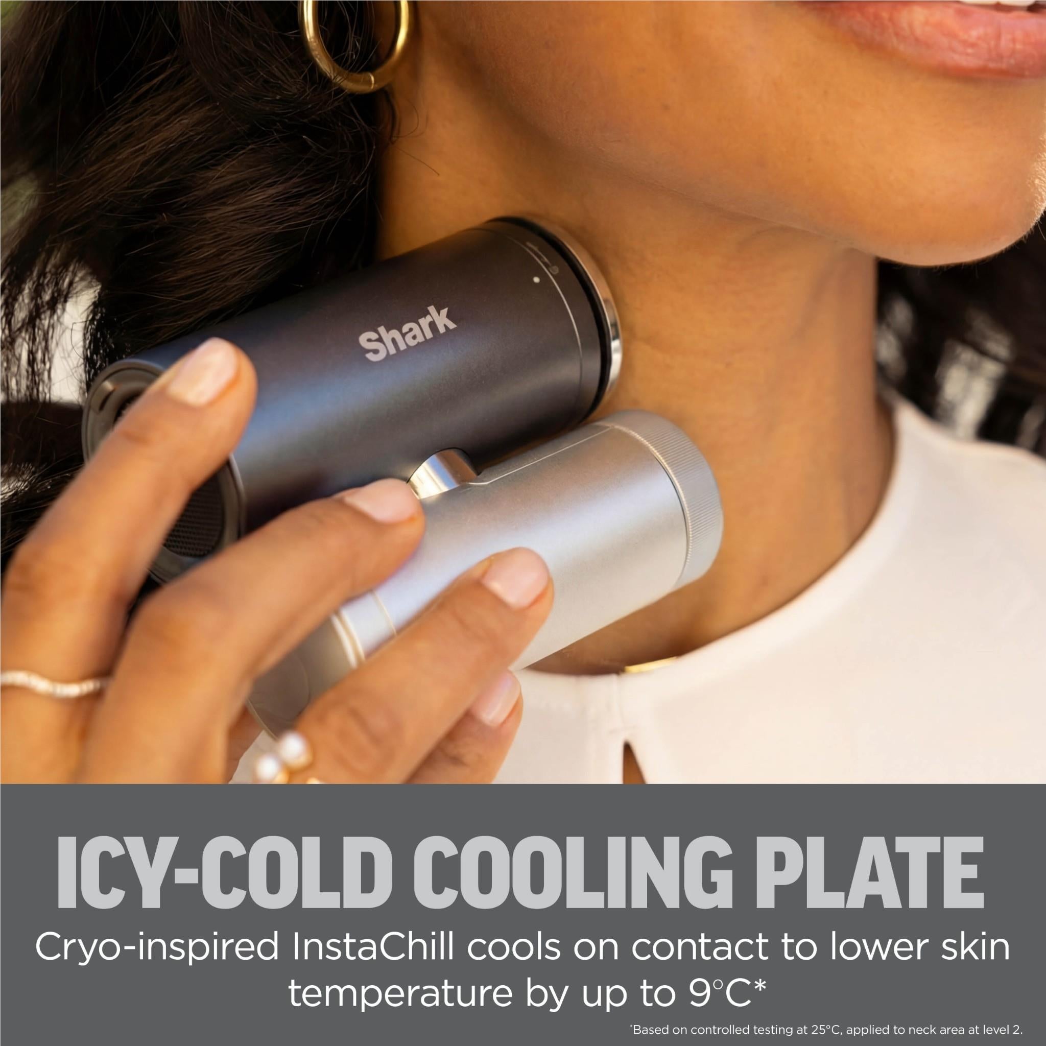 Charcoal and silver handheld cooling fans held near face