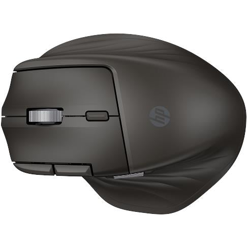 Black mouse underside with charging port area and textured glide feet