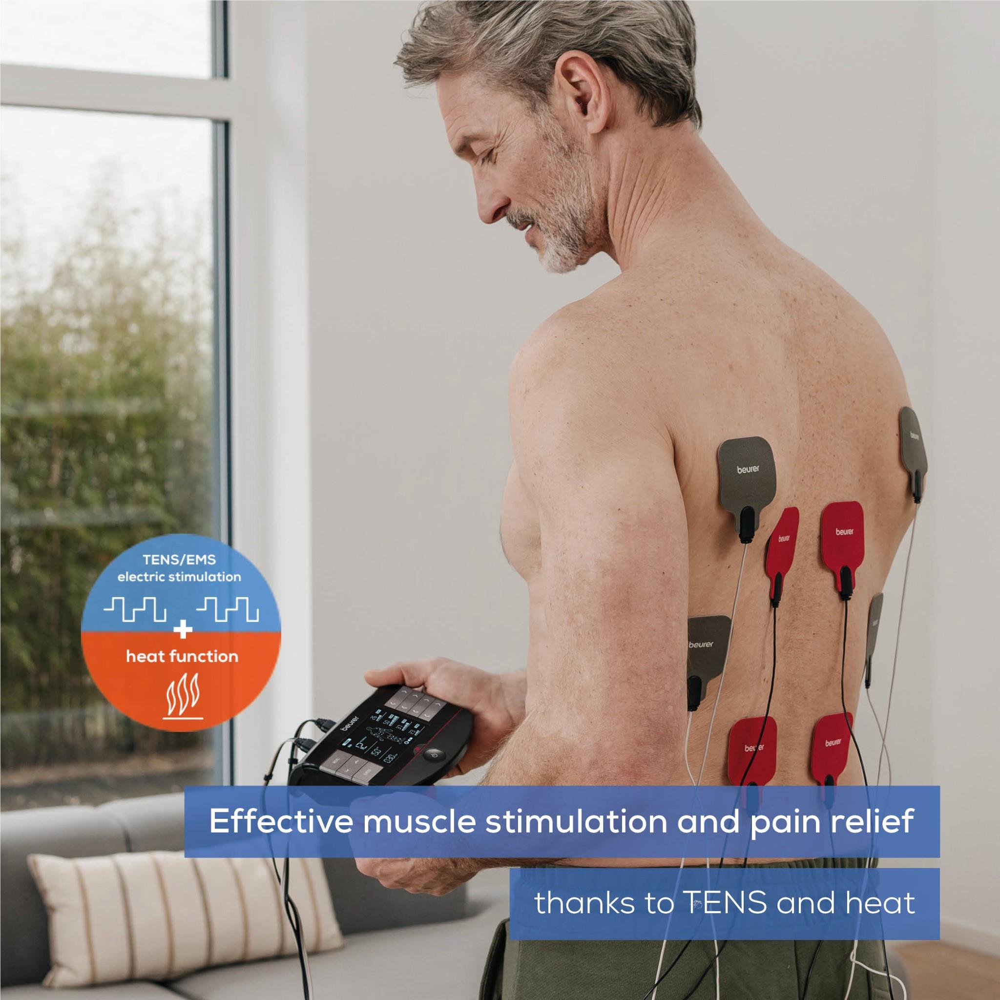 TENS/EMS device on back with four electrode pads and cables to the controller