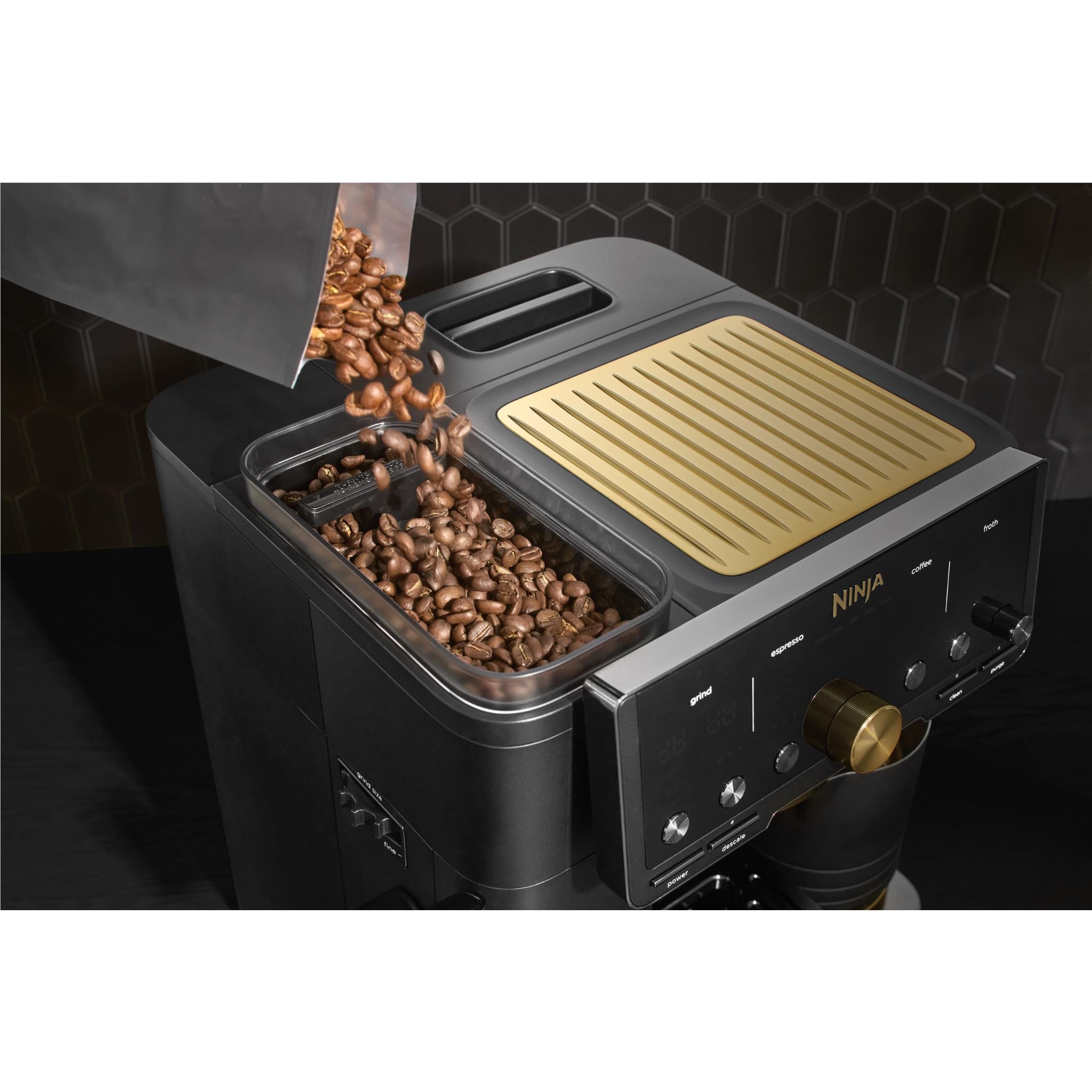 Black espresso system with gold bean hopper lid and exposed coffee beans