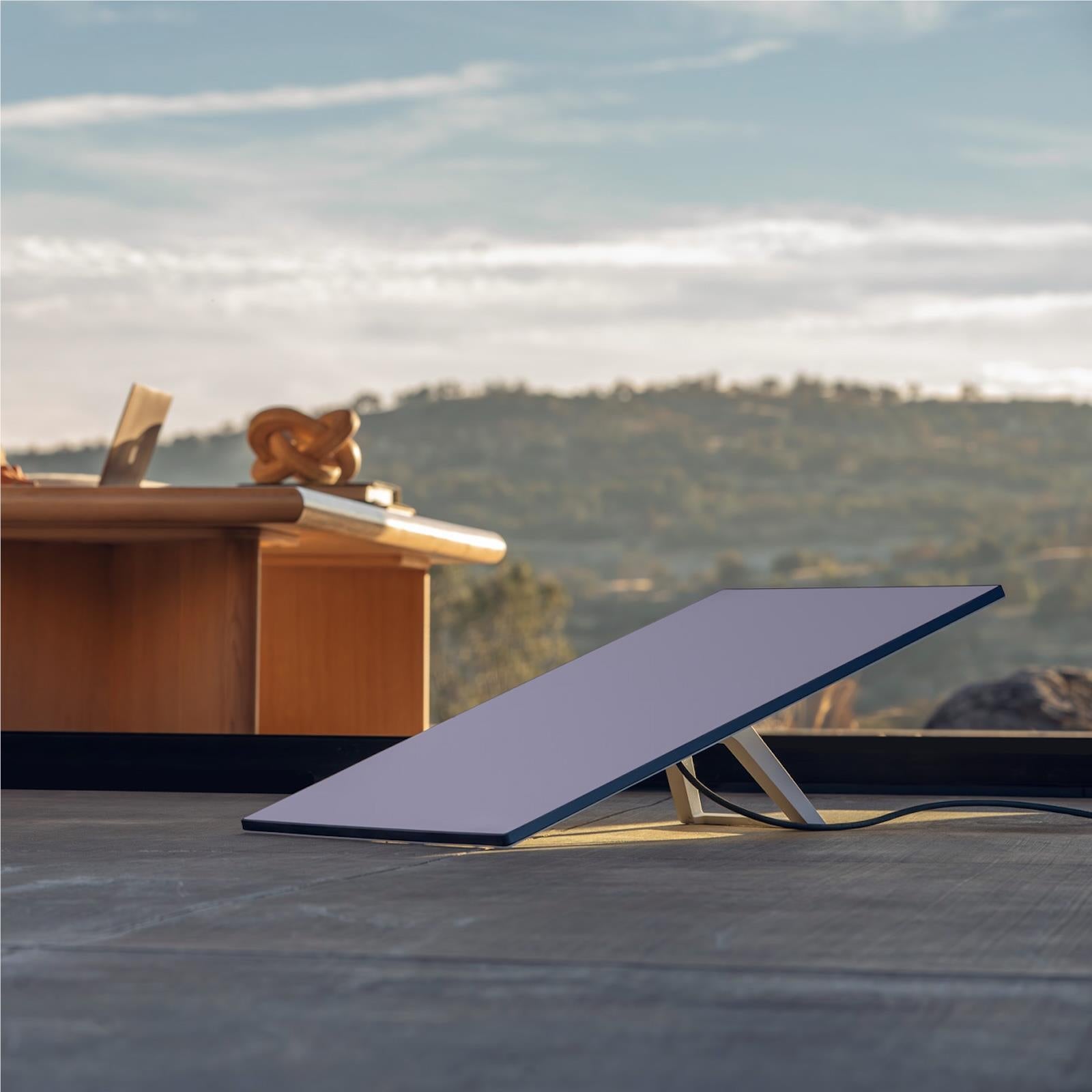 Satellite internet antenna mounted on rooftop surface, angled toward sky
