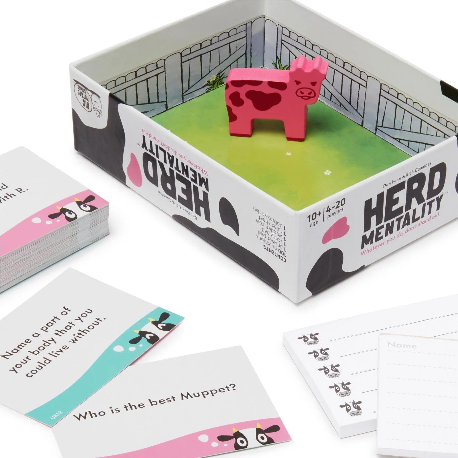 Game box with indoor scene, pink cow token, and prompt cards and score sheets