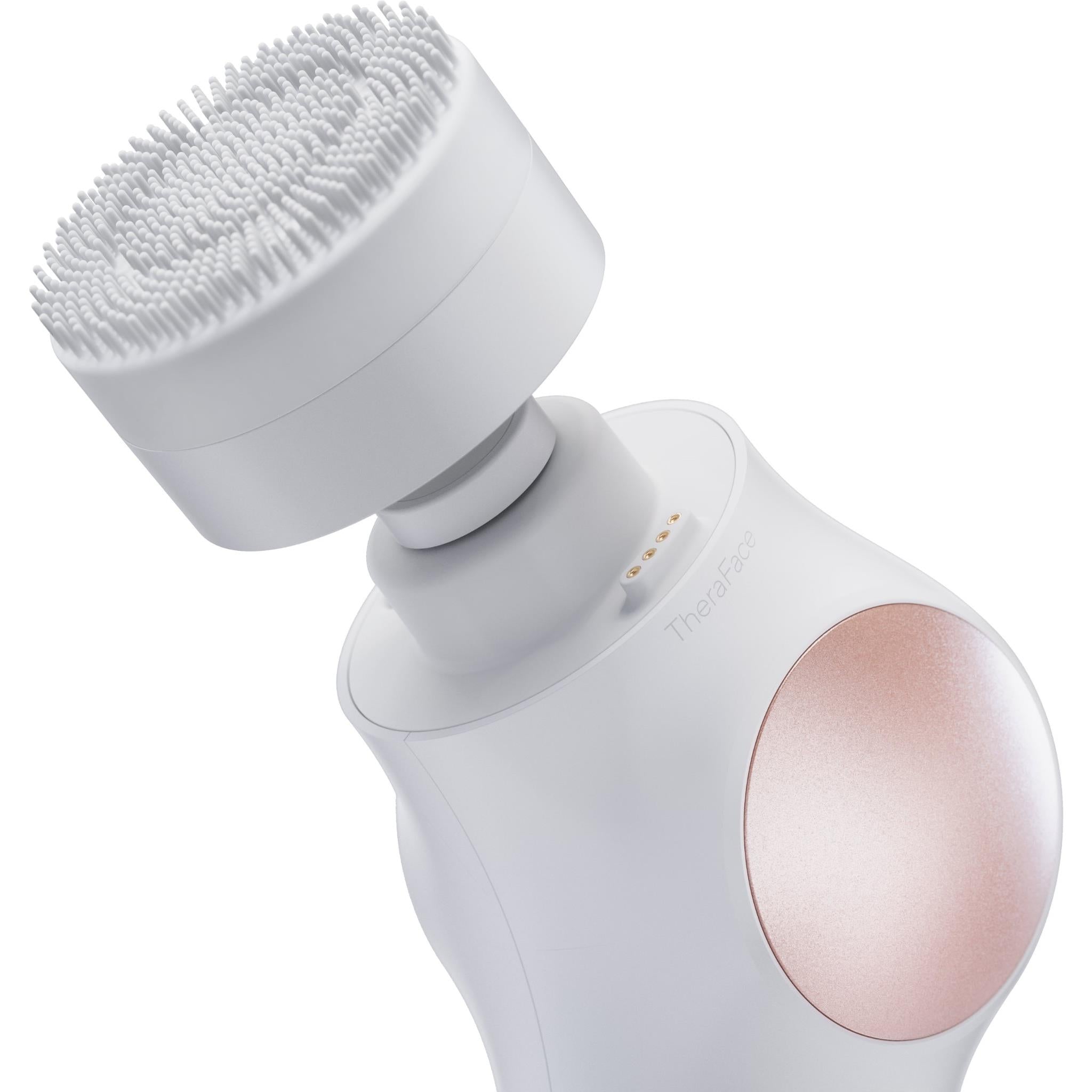 White facial therapy device with textured rotating brush head