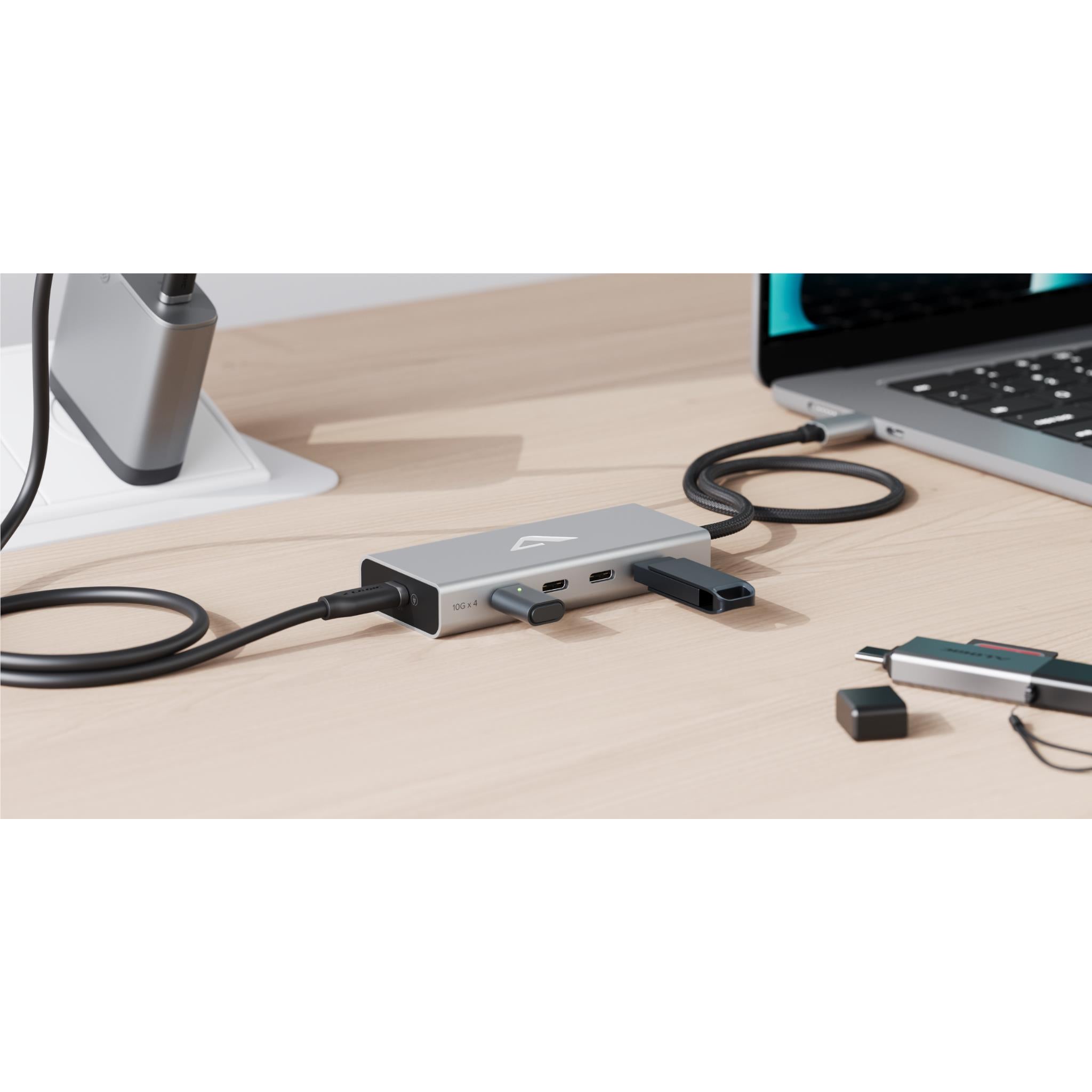 Compact USB-C hub with braided cable and multiple side ports, silver metal finish