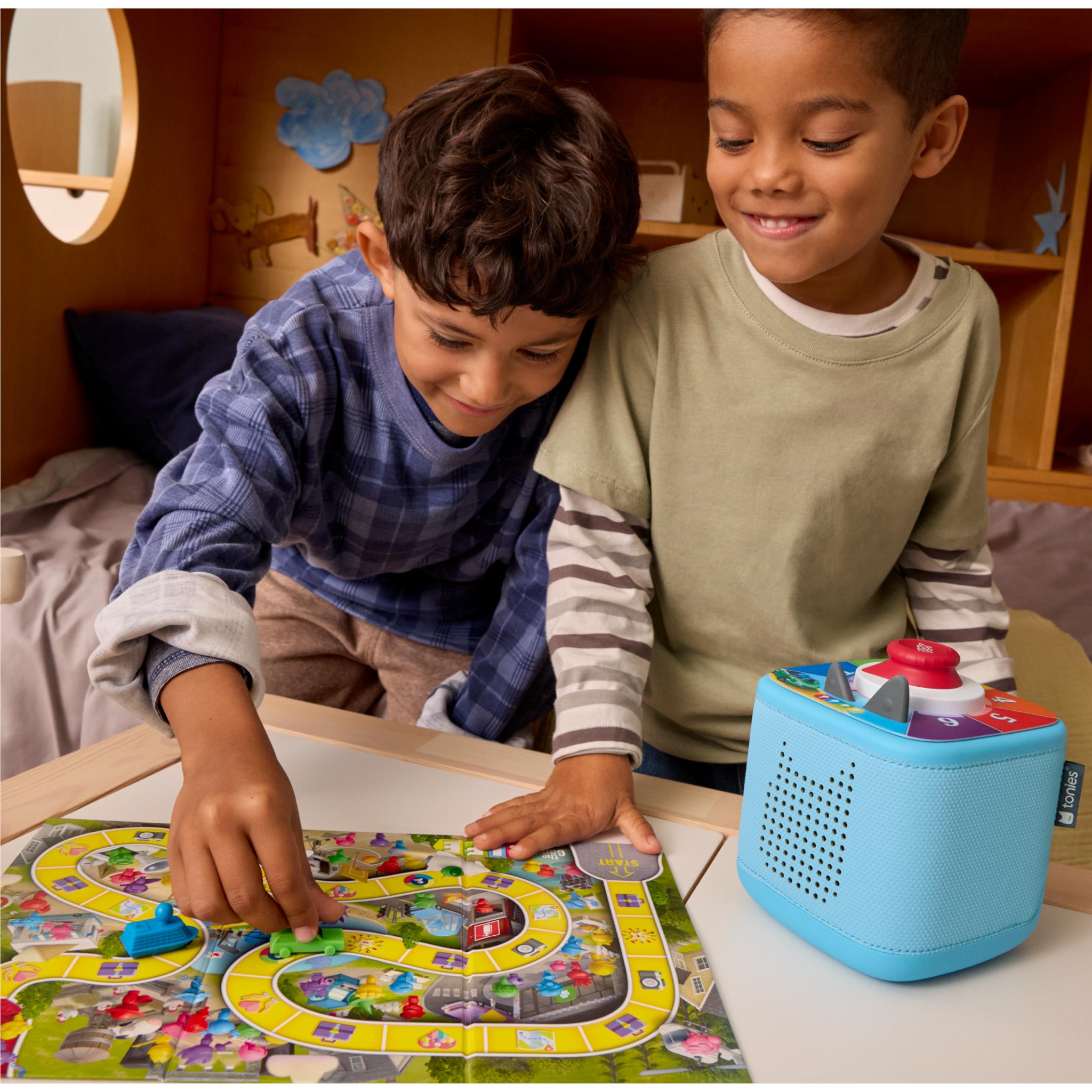 Blue Tonieplay game device with circular speaker top and illustrated board