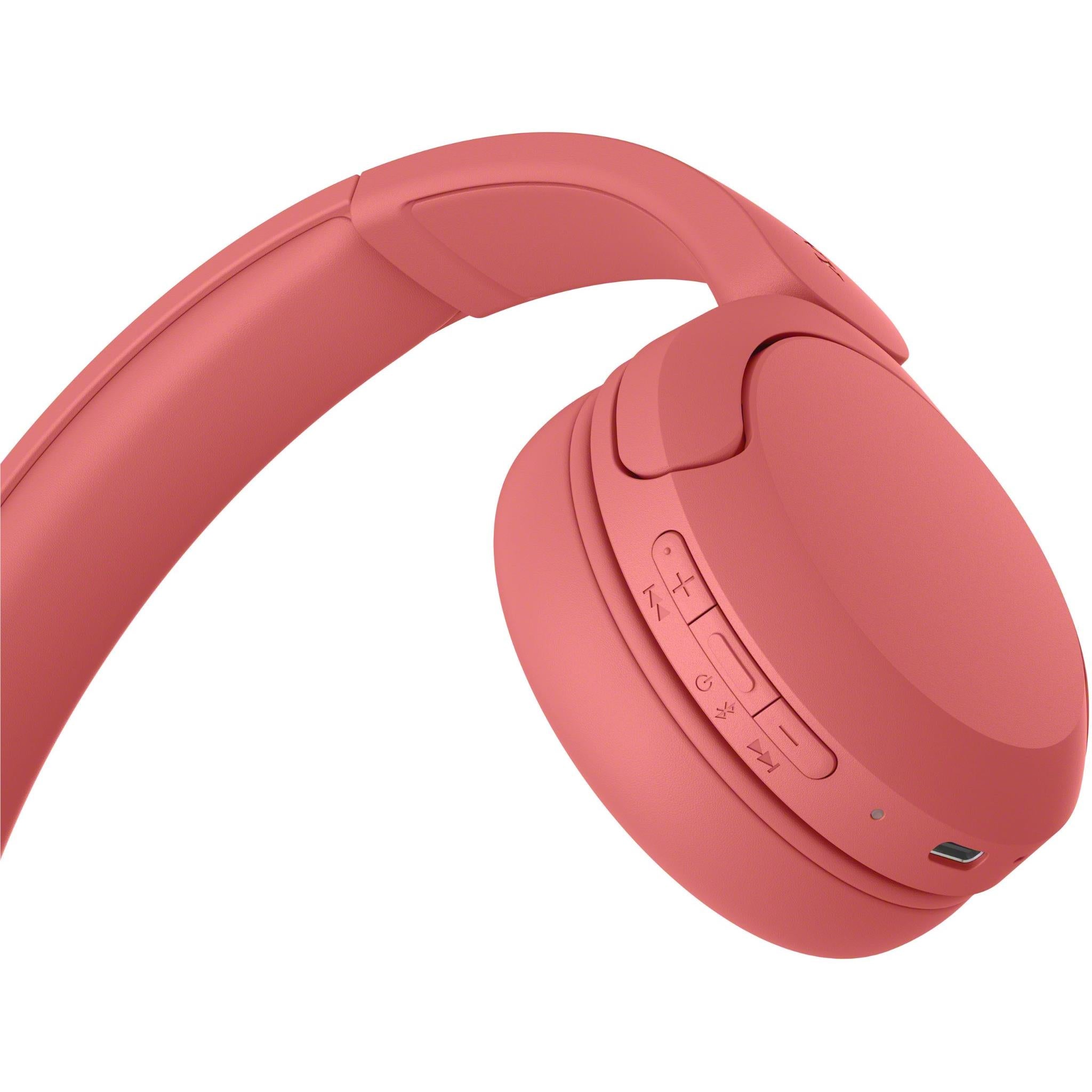 Coral red on-ear headset side view, ear cup controls and small port