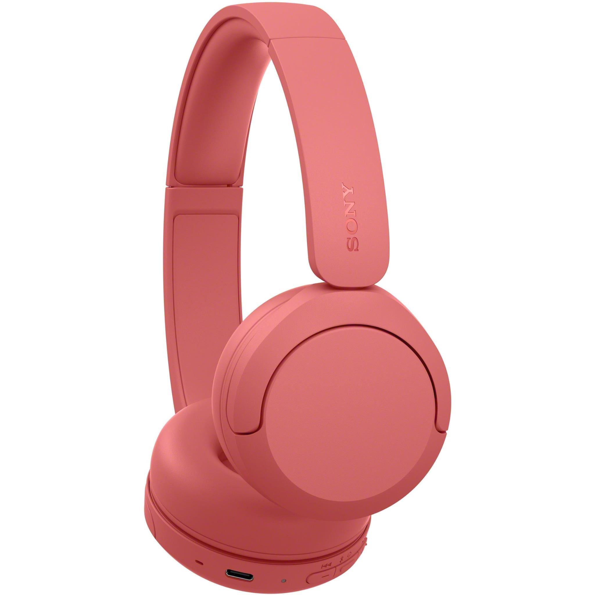 Coral red on-ear wireless headset, angled view with headband and ear cups