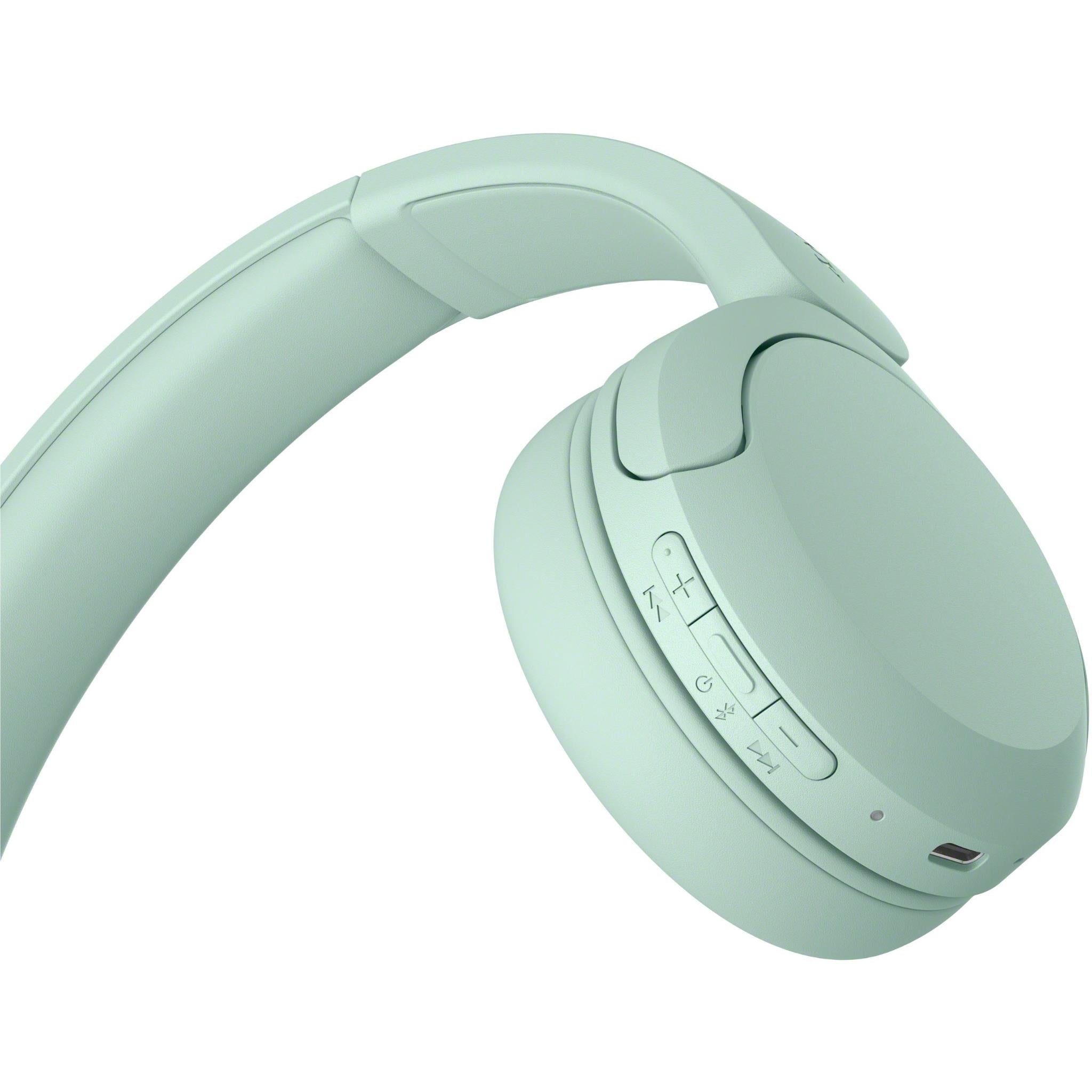 Mint green on-ear Bluetooth headset close-up of ear cup buttons and speaker housing