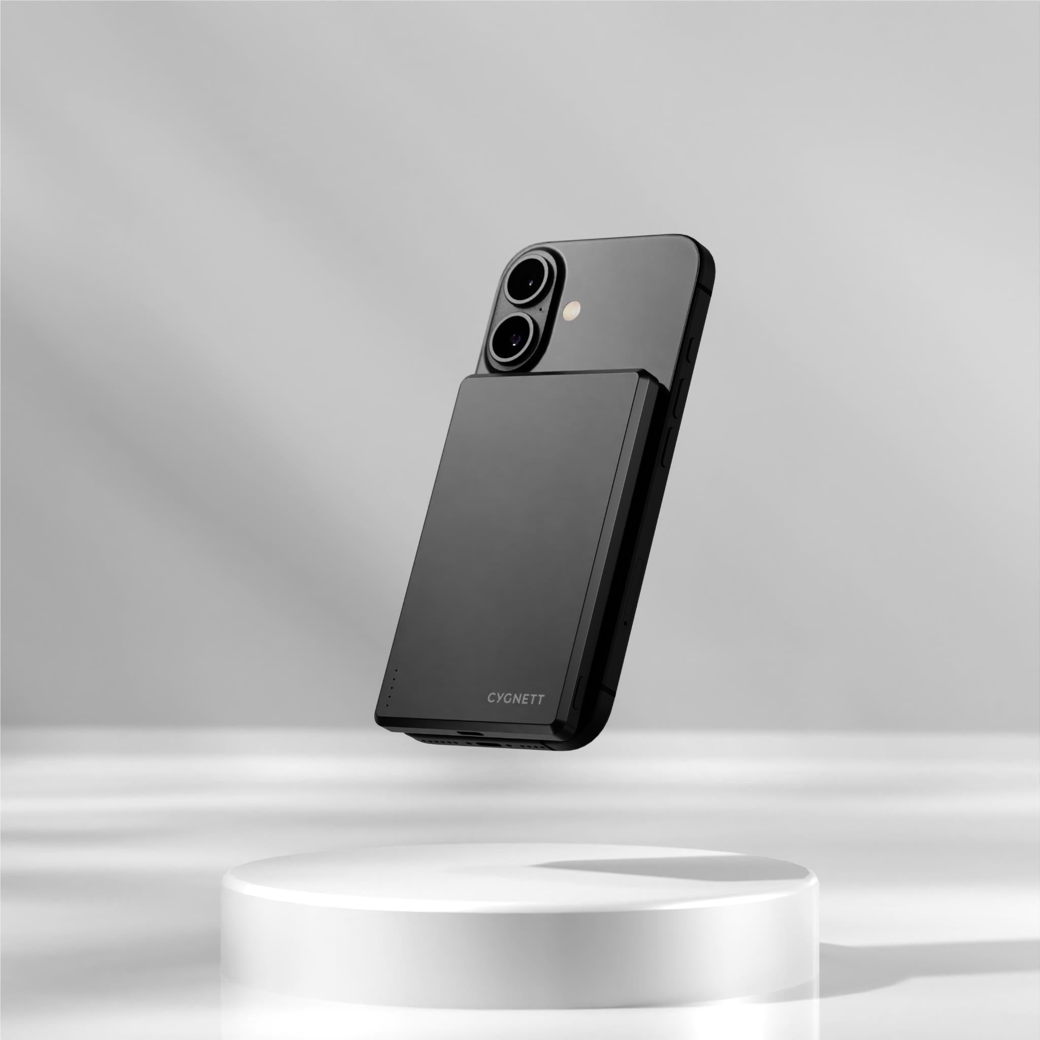 Cygnett magnetic wireless power bank attached to a black smartphone case