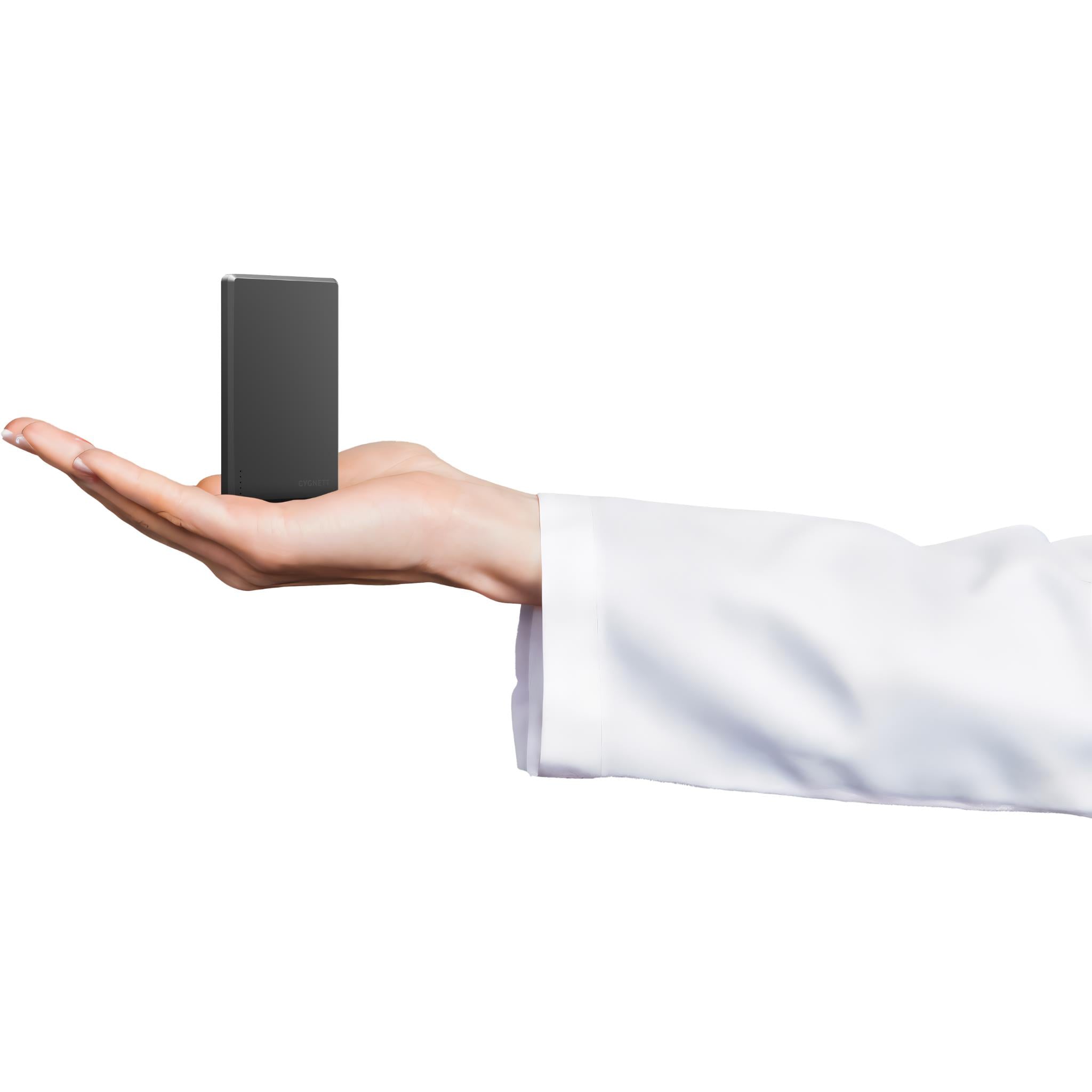 Slim black Cygnett magnetic wireless power bank held in an open hand