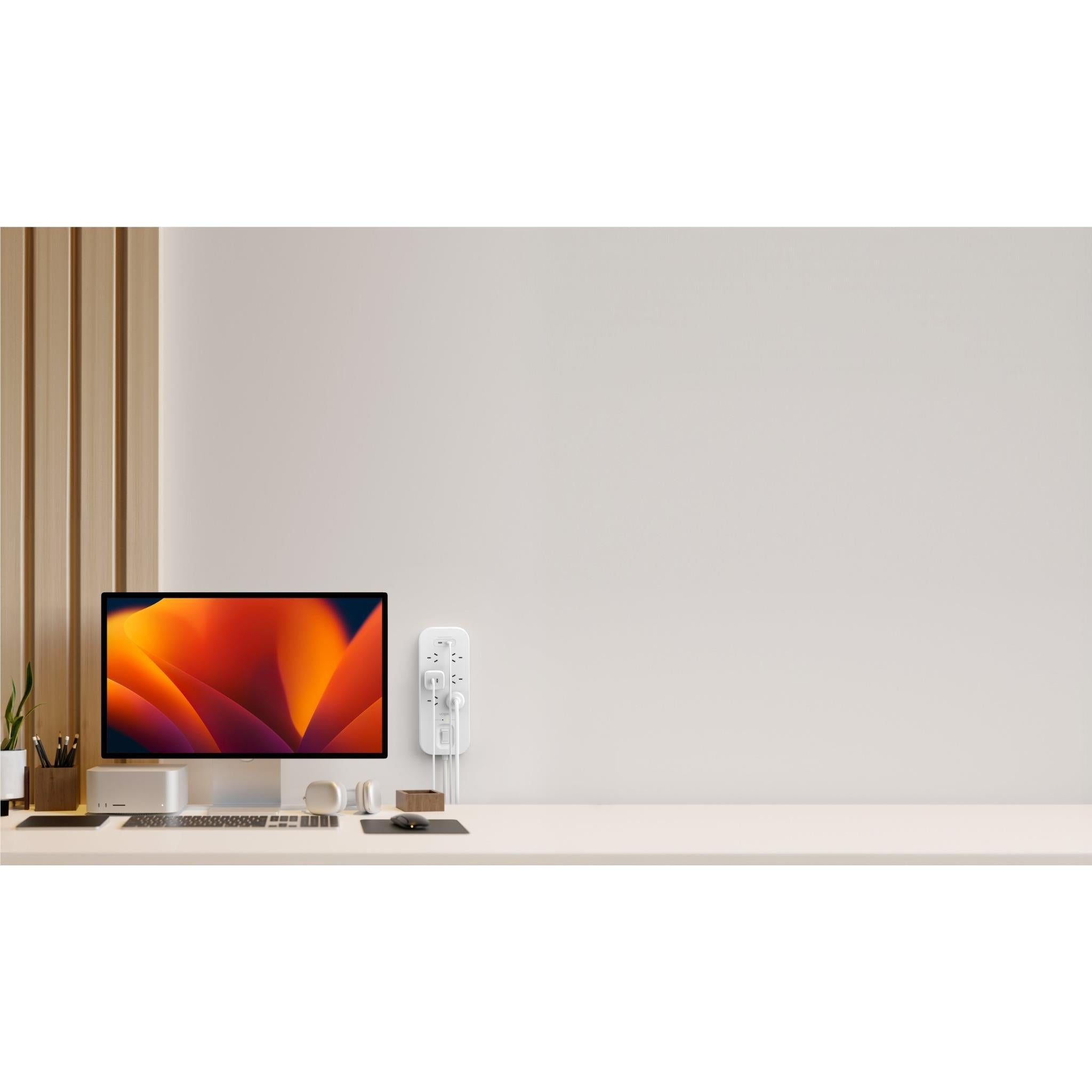 White 6-outlet surge protector with USB-C ports on a desk