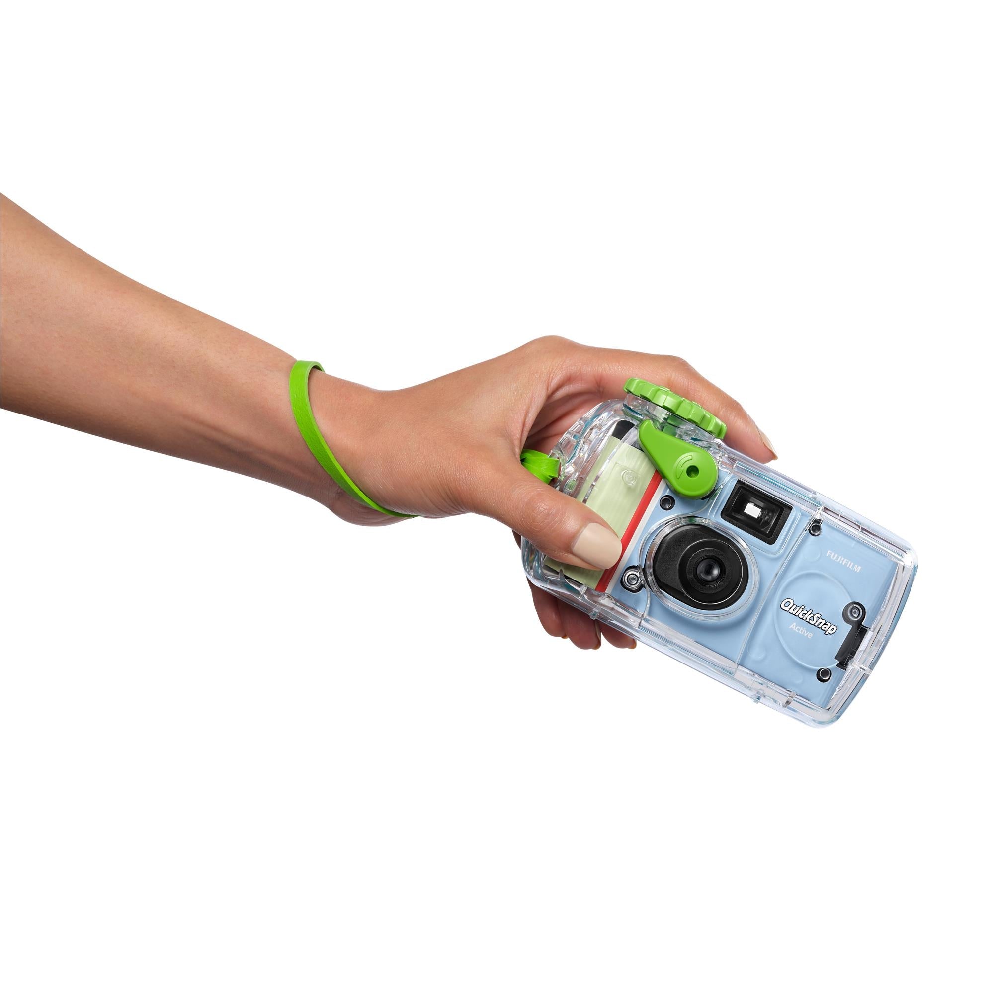 Fujifilm QuickSnap waterproof camera, light blue body and green strap held in hands