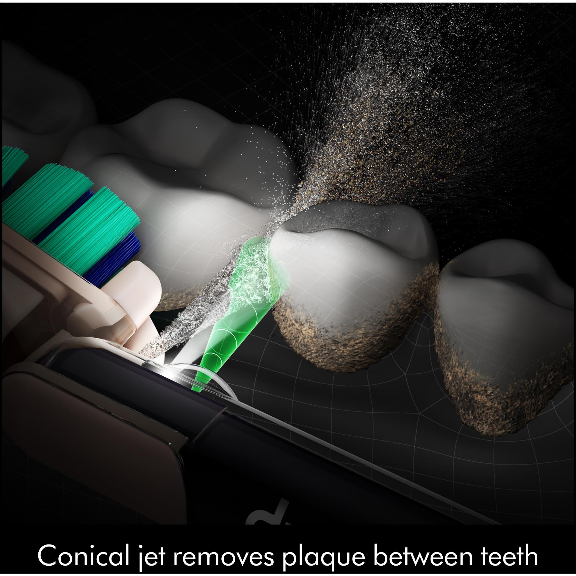Dyson CameraJet toothbrush flosser jet spraying between teeth with water mist