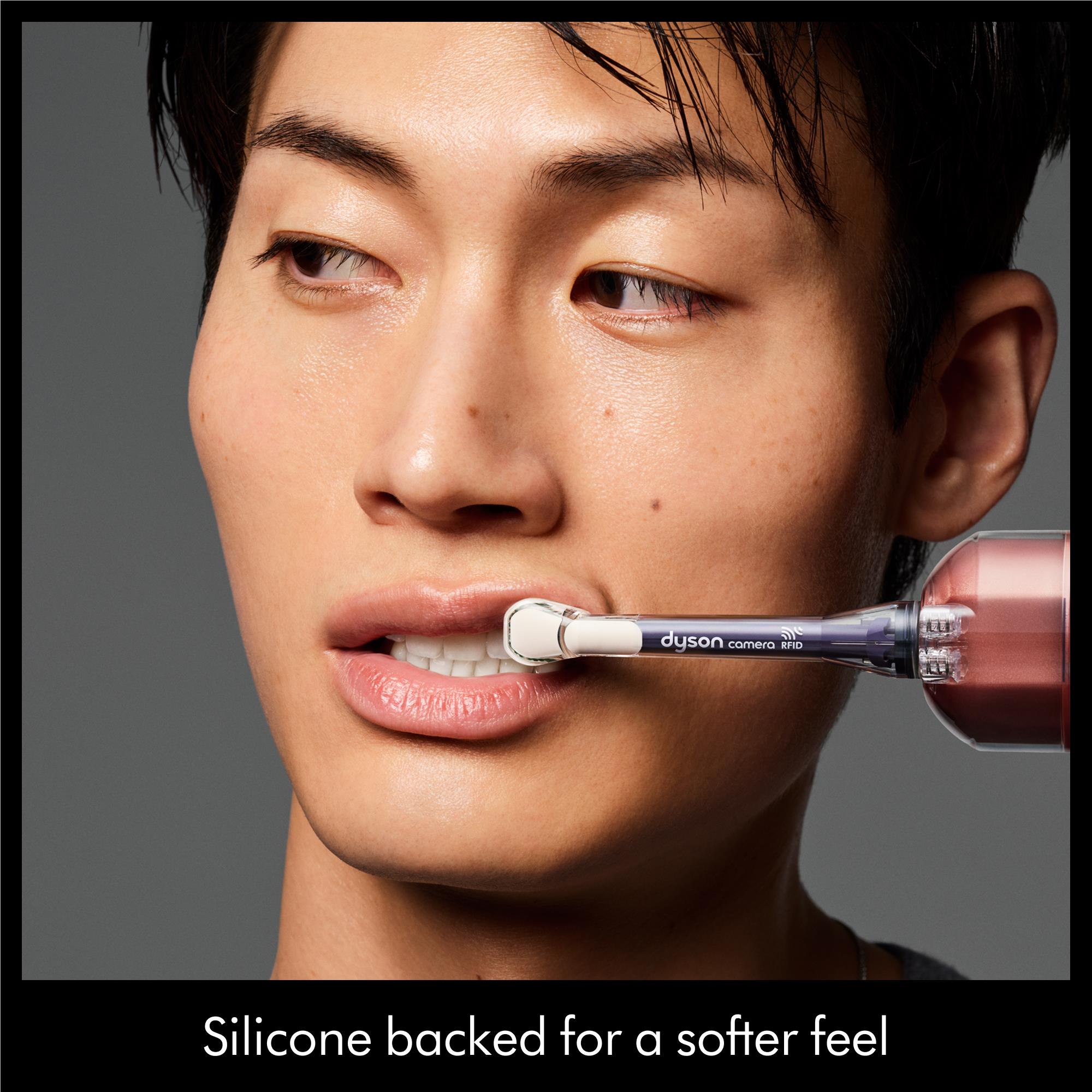Dyson CameraJet dual-bristle brush head used on face gumline area