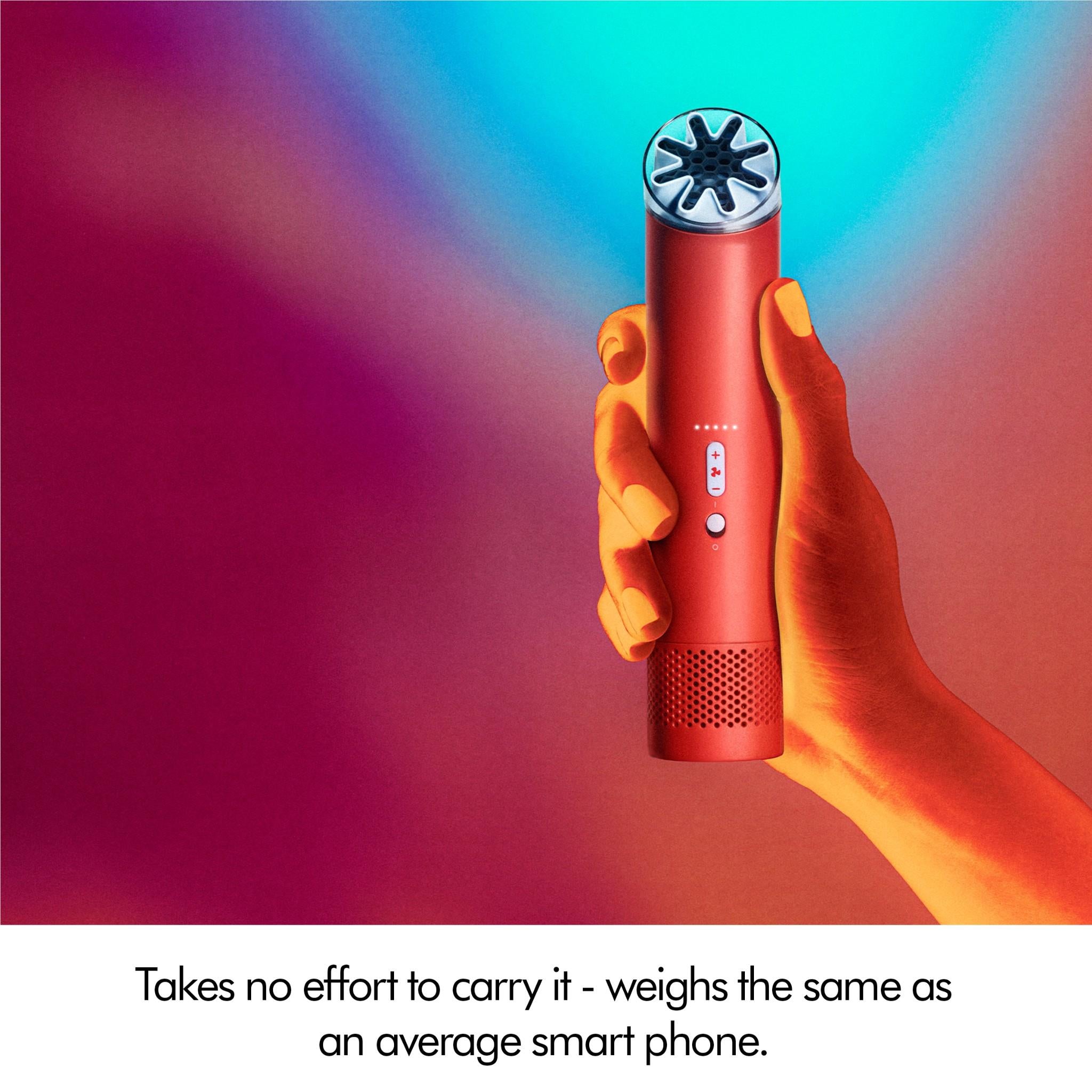 Handheld mini cool fan with red body and sky-blue top, held in a hand