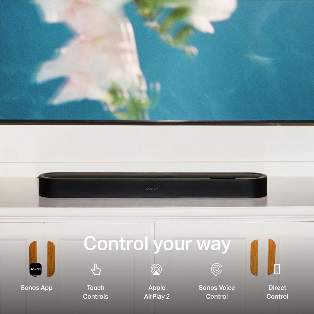 Black Sonos Beam Ultra soundbar installed under a TV on a shelf