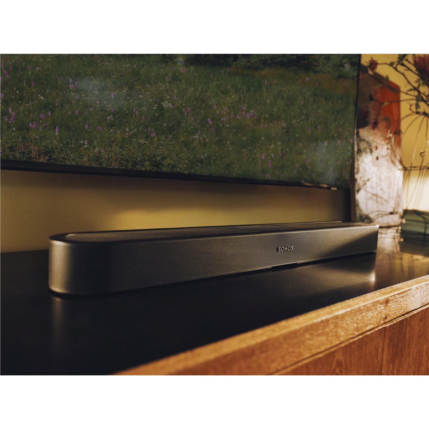 Black Sonos Beam Ultra soundbar on a console beneath a wall-mounted TV
