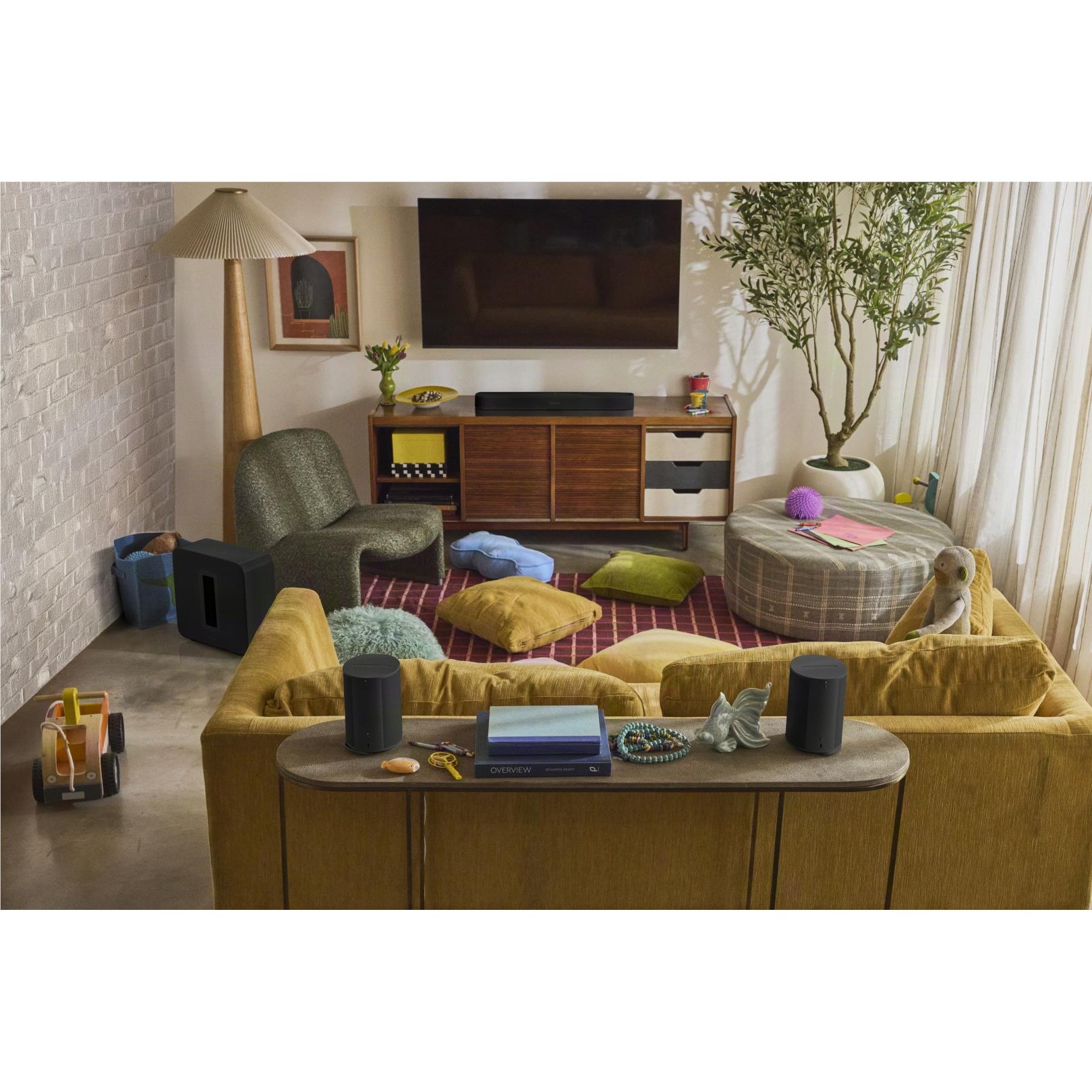 Black Sonos Beam Ultra soundbar in a living room next to a TV stand