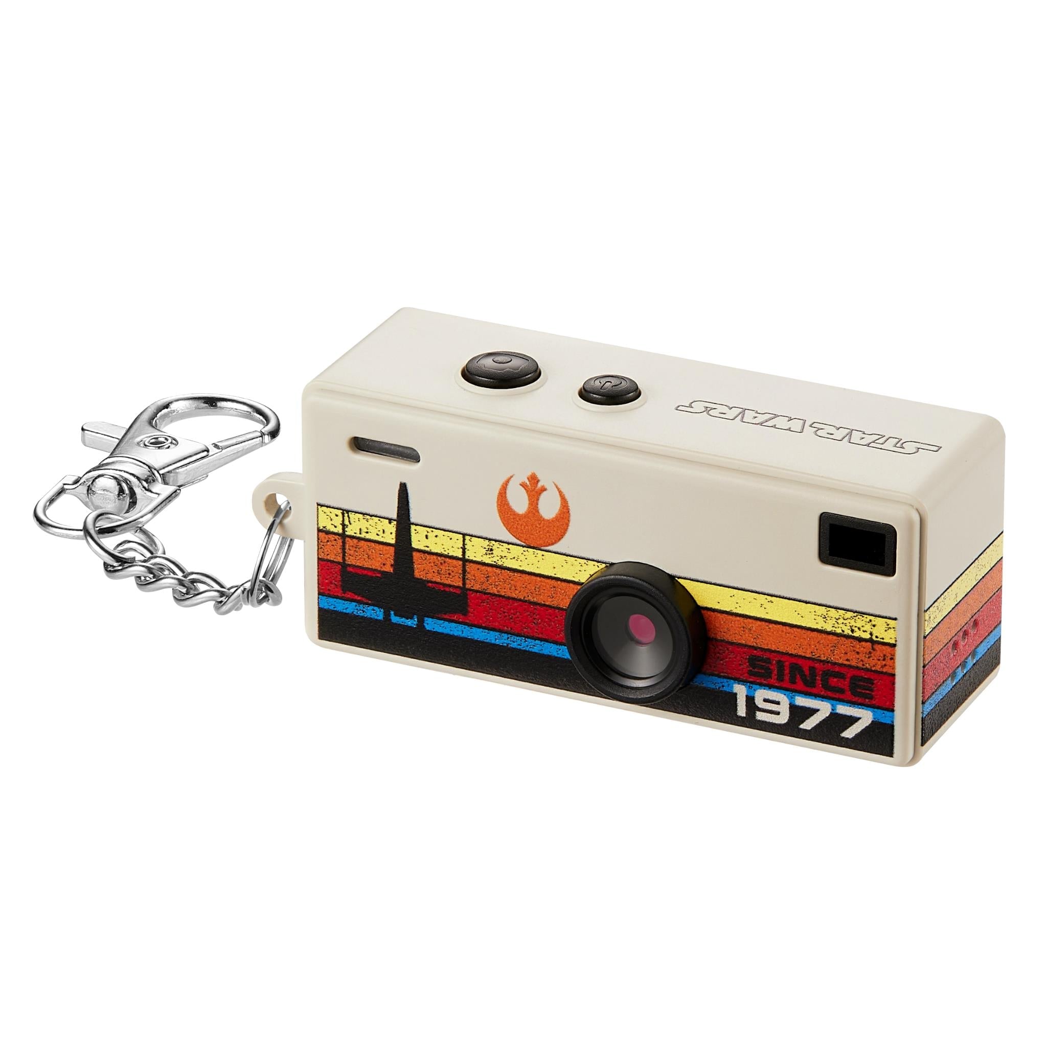 Beige keyring camera with chrome keyring, retro stripe body, and front lens