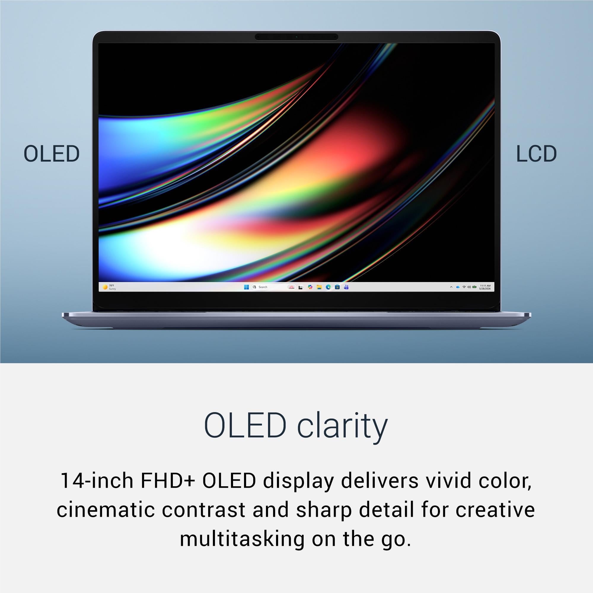 14-inch laptop with black display bezel and silver body, showing colorful OLED screen
