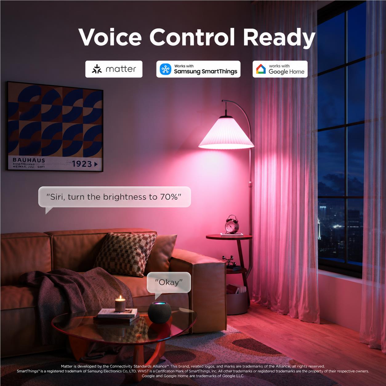 Smart colour bulb with voice control ready, pink and purple light near a lamp.