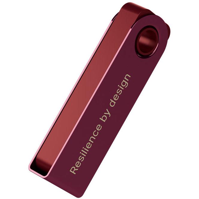 Crimson magenta hardware wallet back with 'Resilience by design' text and ring hole