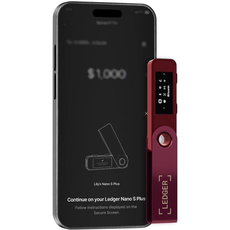 Crimson magenta hardware wallet attached beside a smartphone showing instructions