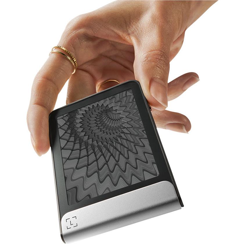 Ledger Flex crypto hardware wallet close-up, dark graphite with textured display