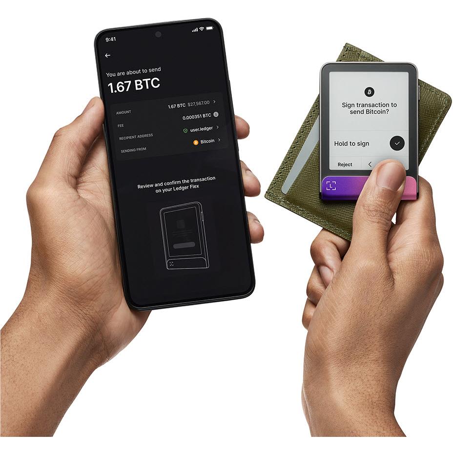 Hardware wallet being used with phone and recovery cards, dark body and magenta base