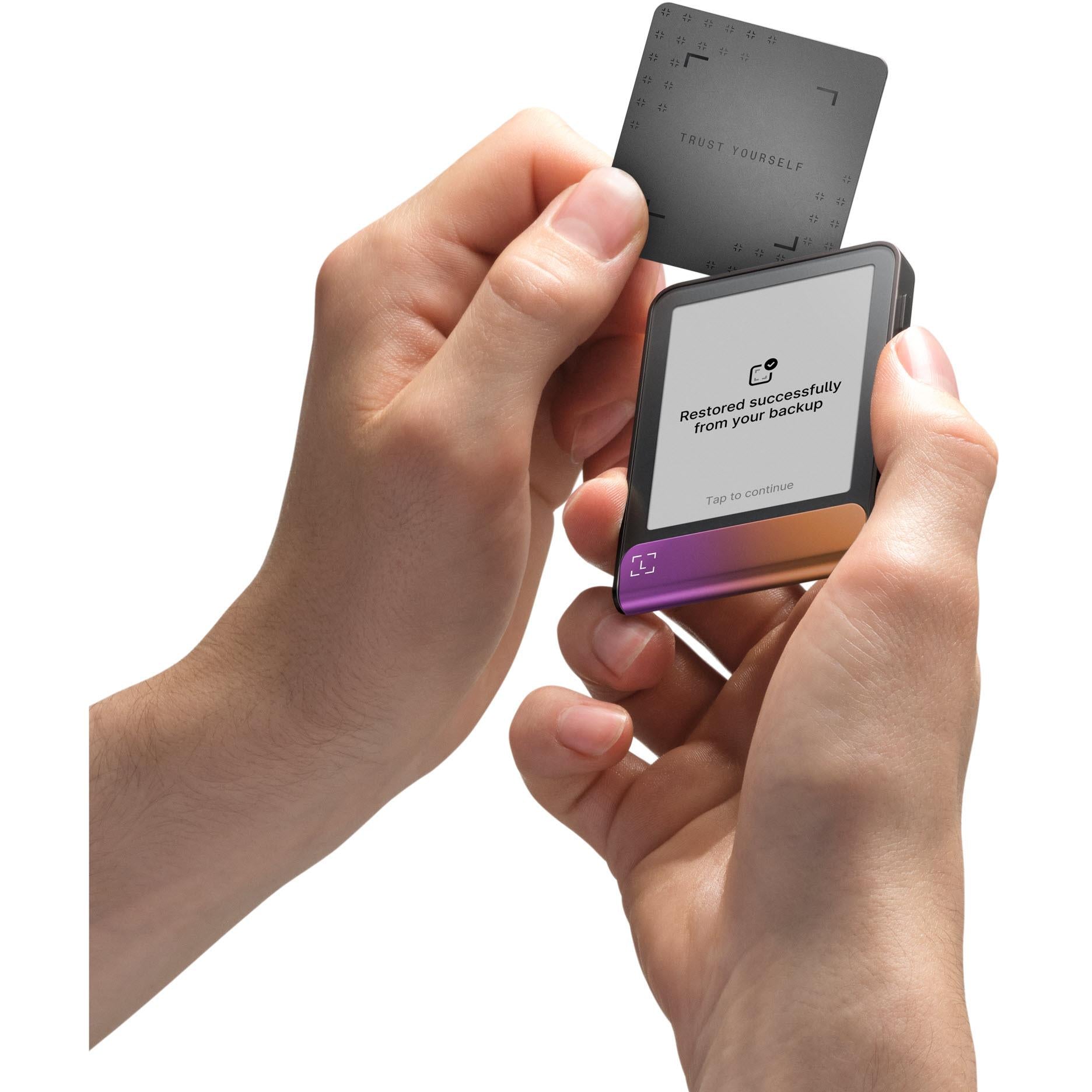 Ledger Flex cold storage wallet and recovery key card, hands holding device with status screen