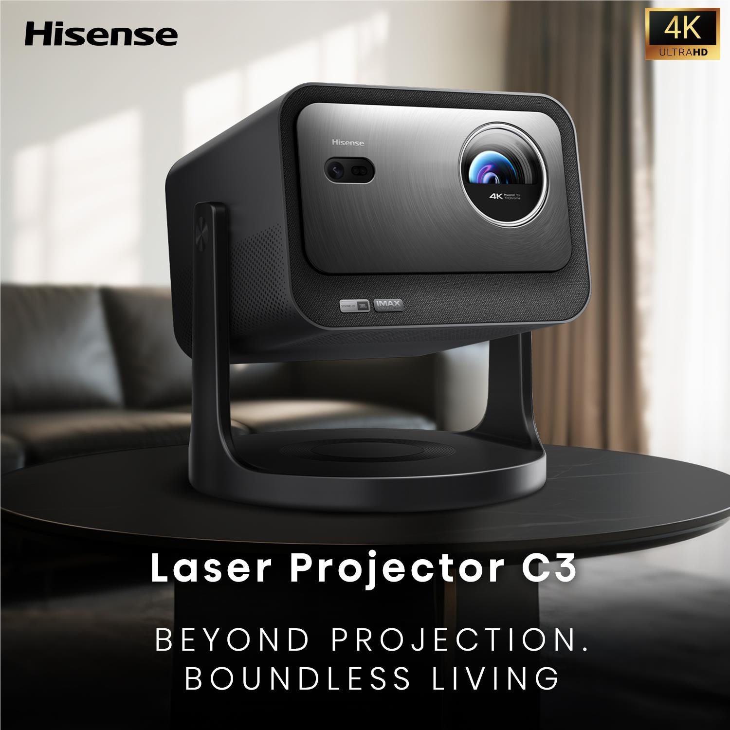 Black laser projector with Hisense logo and 4K Ultra HD badge, front close-up