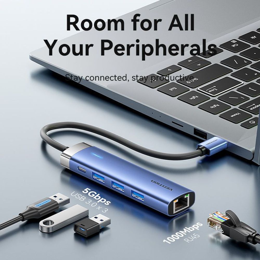 Blue aluminum multiport USB hub connected to a laptop with several device ports