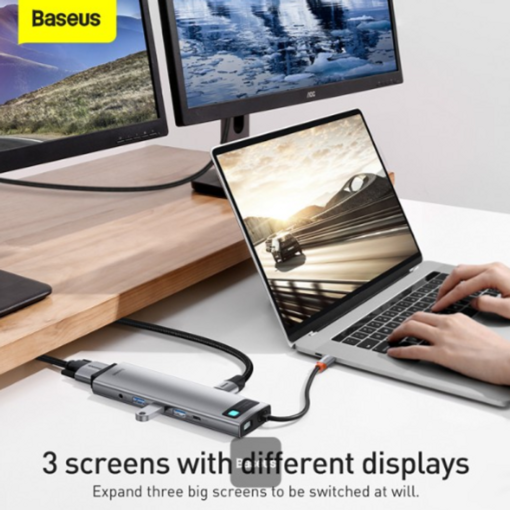 Space gray USB-C docking hub connected to laptop with side ports visible