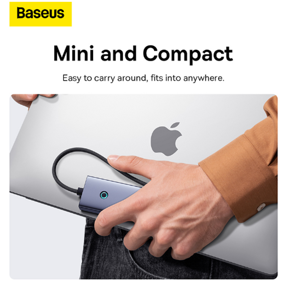 Space gray USB-C 4-port hub connected to a laptop, showing front indicator and cable