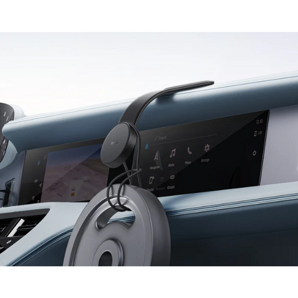 Baseus magnetic phone mount attached to car dashboard, black circular puck and arm