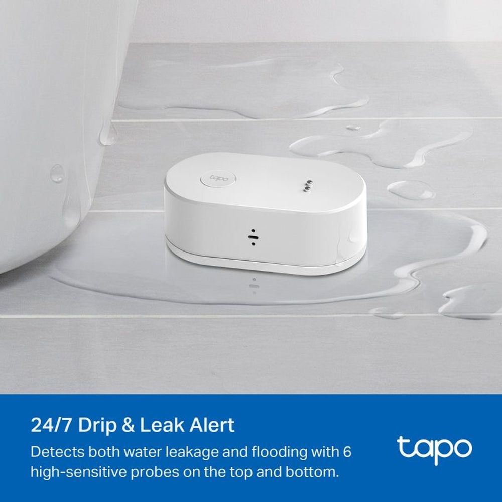 TP-Link Tapo smart water leak sensor on surface with water splashes nearby