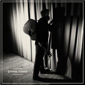 Book cover with silhouetted figure holding a microphone and instrument