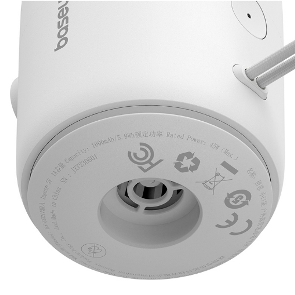 Close-up of white air pump base with circular vent and control icons