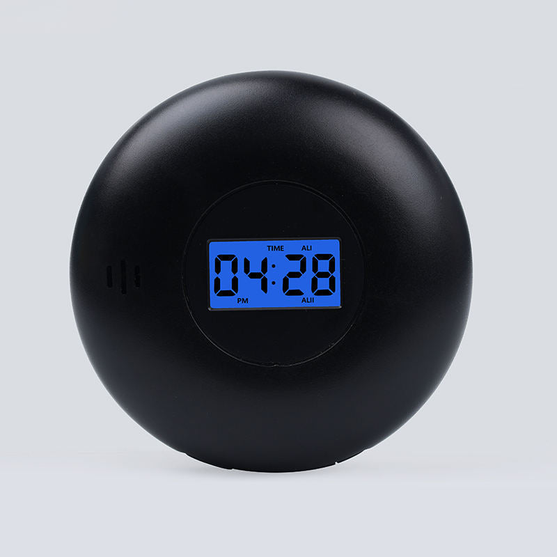 Black round vibrating dual-alarm clock with blue digital time display
