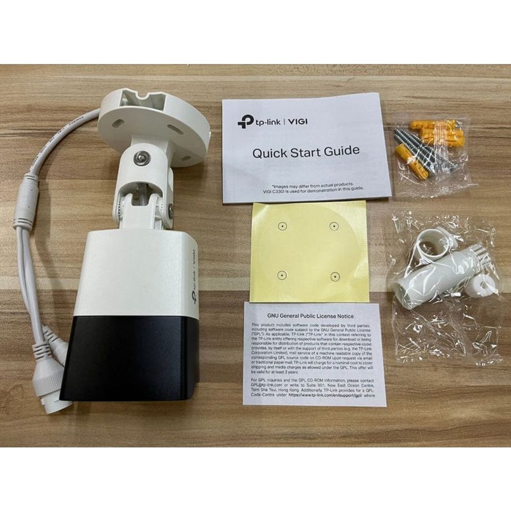 Outdoor bullet camera with mount, quick start guide, and included hardware