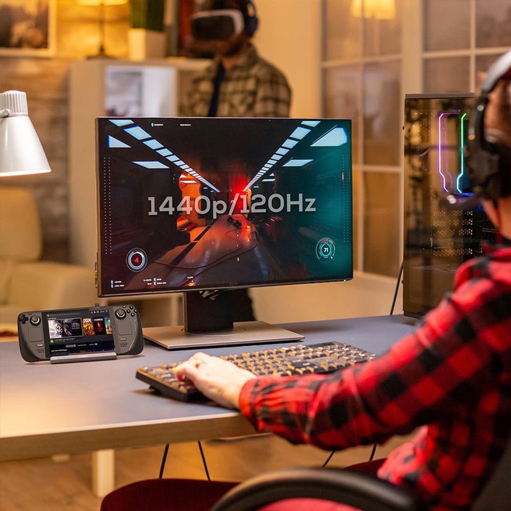 Gray USB-C gaming dock with connected cables on tabletop