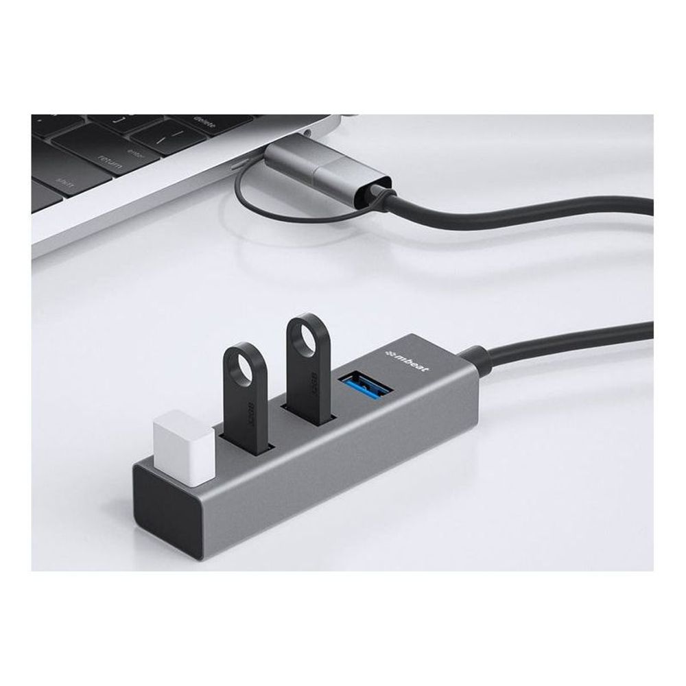 Space gray 4-port USB hub with USB-C converter, upright base and blue USB-A ports
